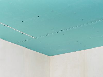 Plasterboard ceiling on an installed profile frame. Apartment or office renovation. A cheap and quick way to make a partition or ceiling in a room or warehouse.